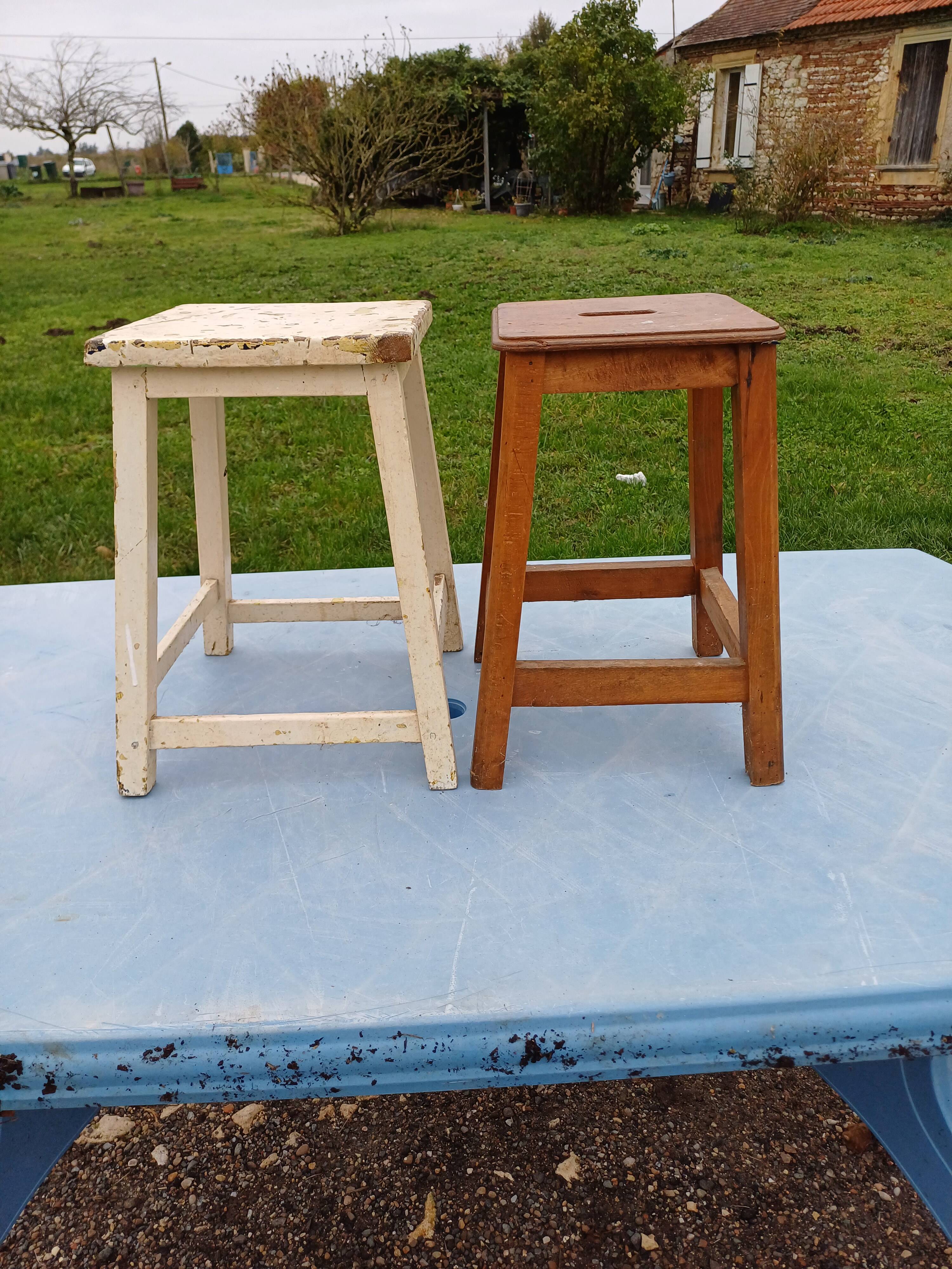 2 wooden workshop stools