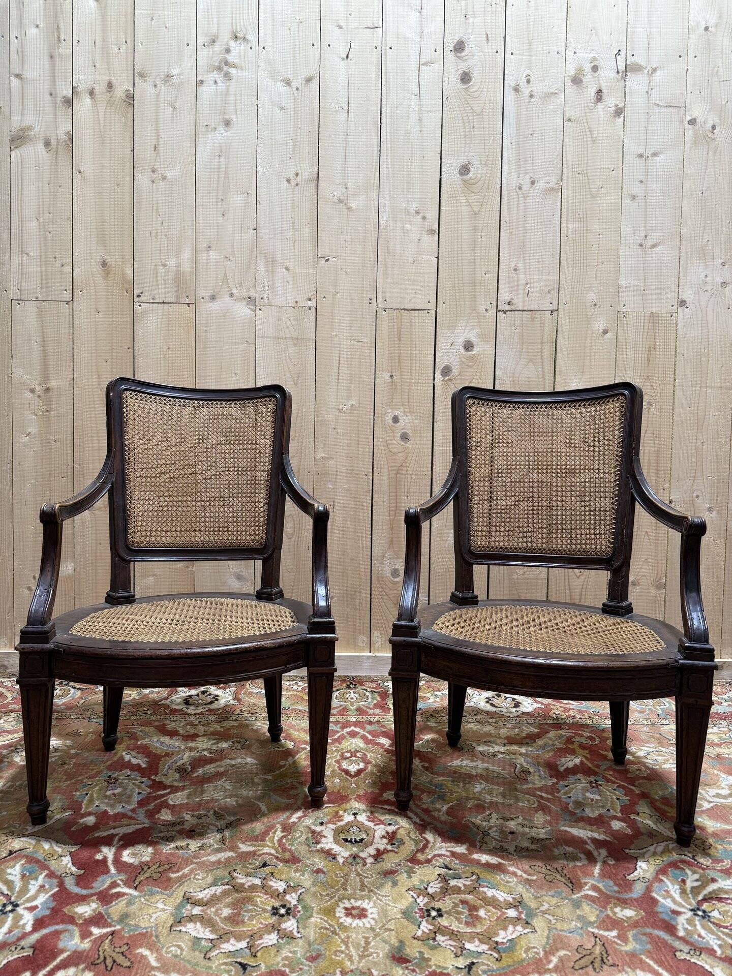 Pair of Louis XVI period caned armchairs