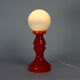 Orange glass table lamp by vitropol, poland 1960s