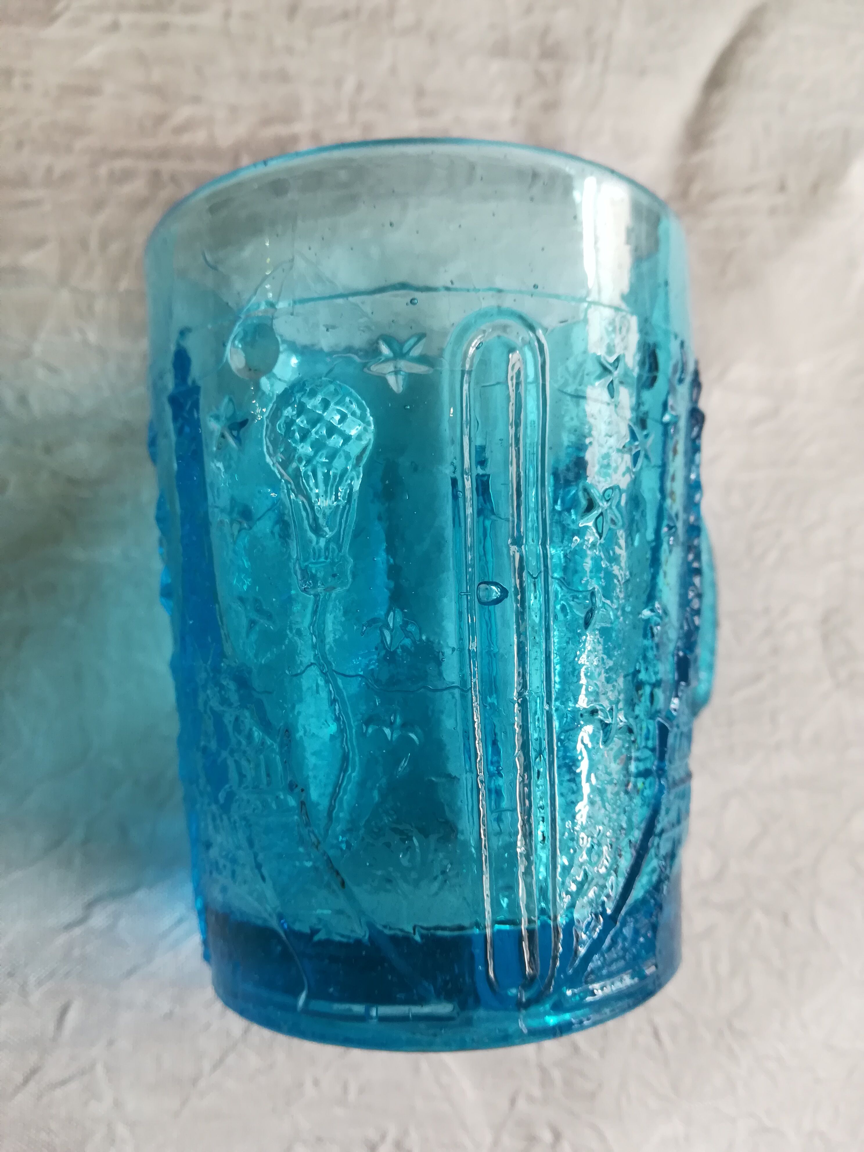 Old turquoise glass cup