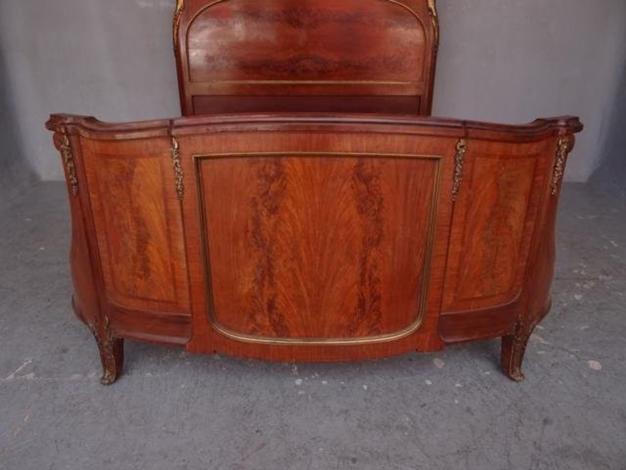 Golden bronze Louis XVI style mahogany bed