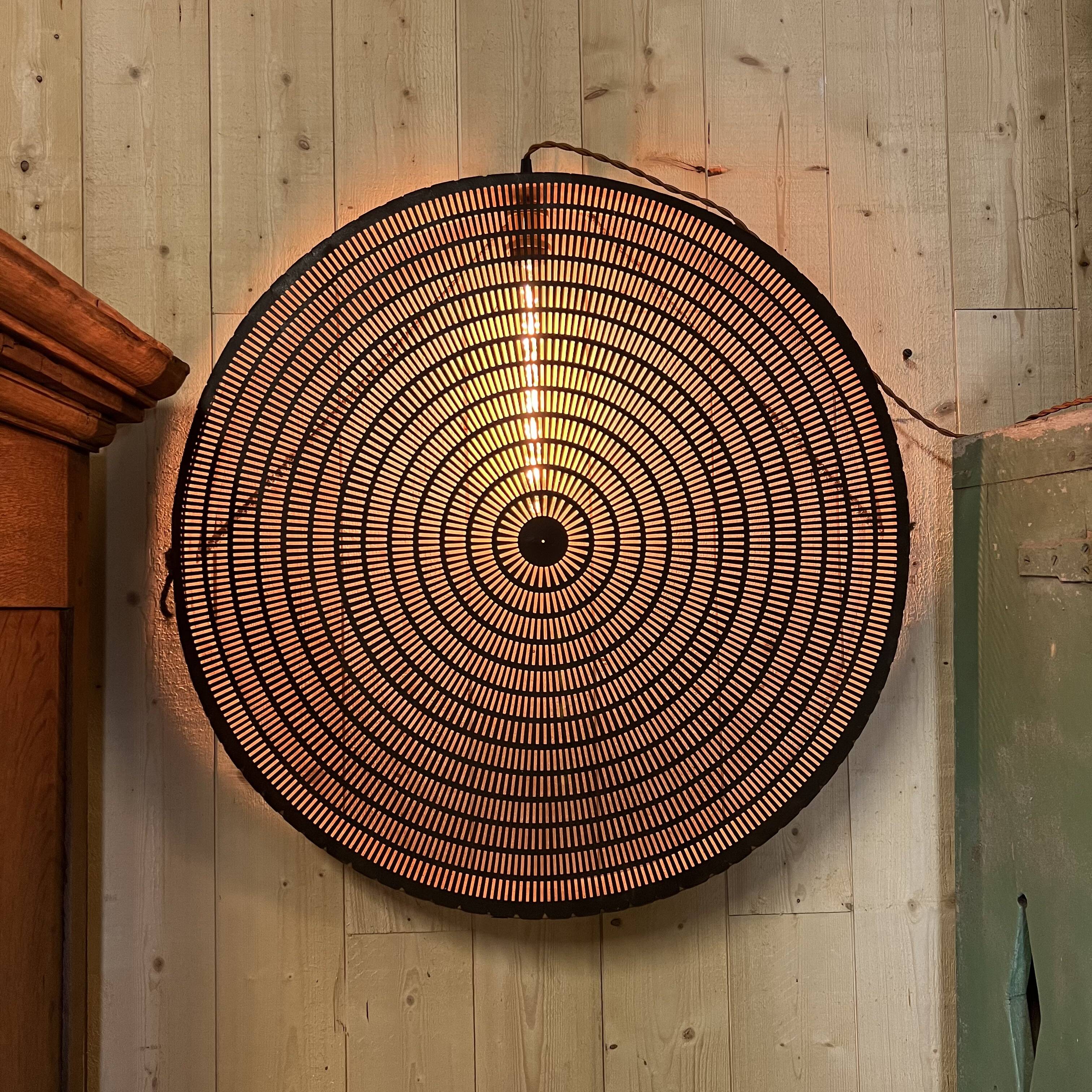 Old lamp in wood and metal worked with integrated lamp.