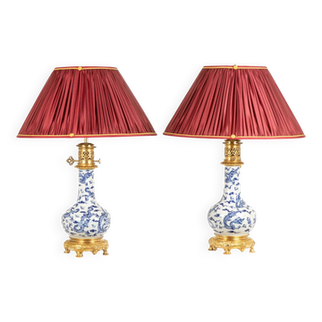 Pair of porcelain lamps decorated with dragons and gilded bronze, circa 1880.