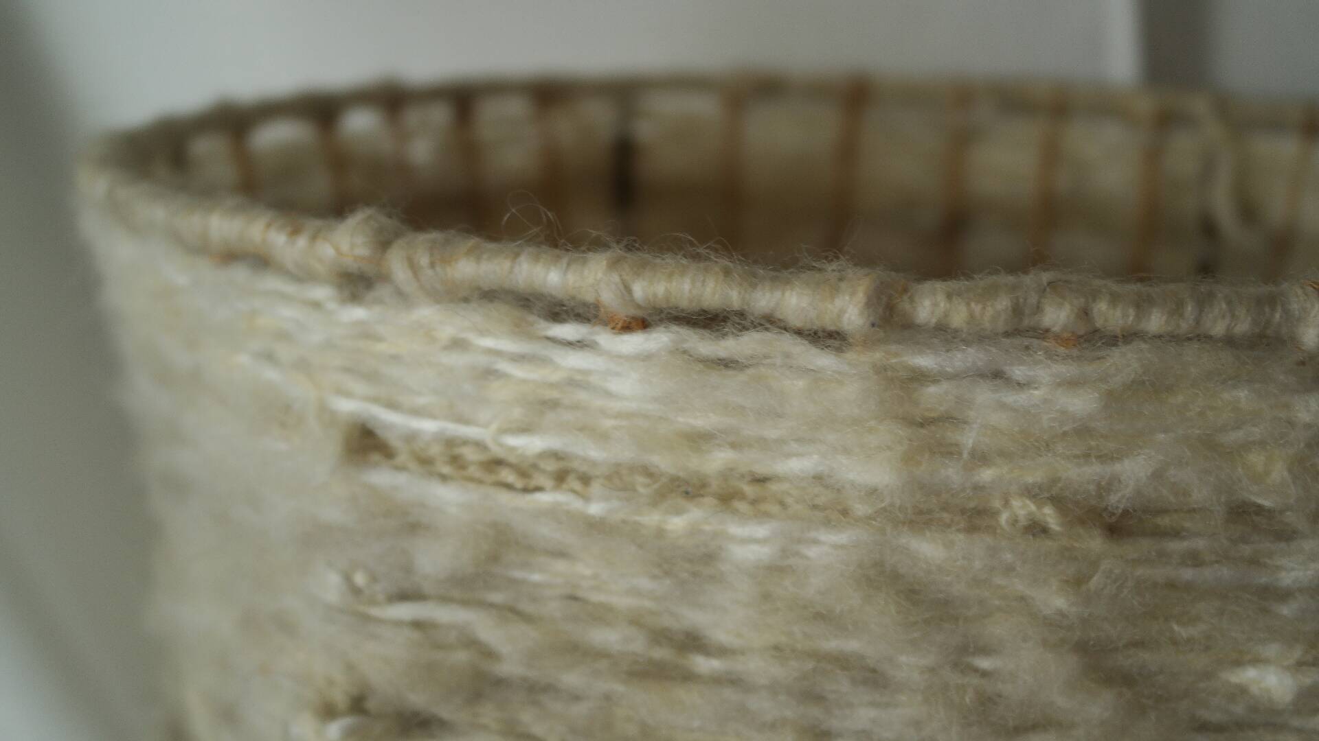 Vintage ceramic lamp with a wool shade.