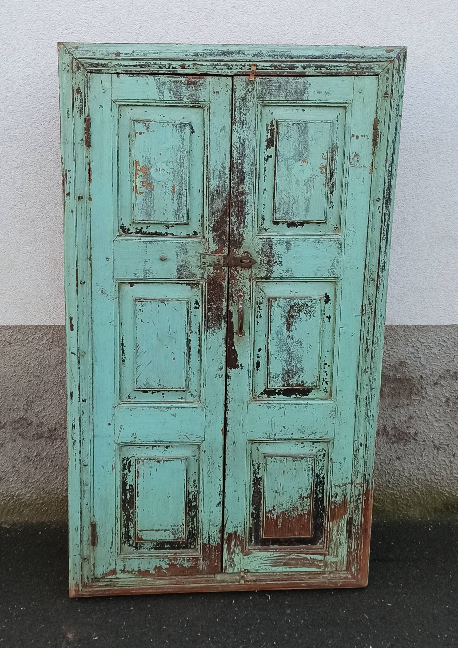 Old wooden cabinet with beautiful green patina