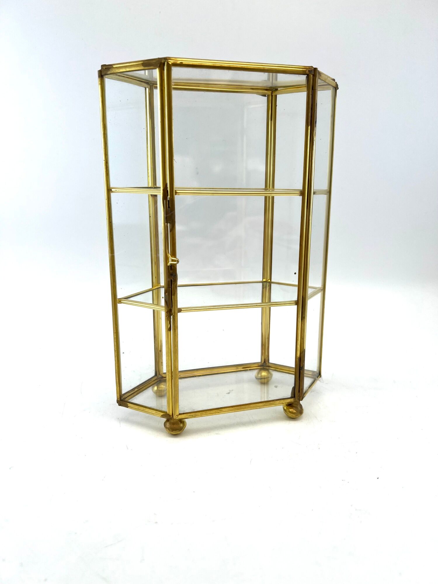 Glass and brass jewelry showcase