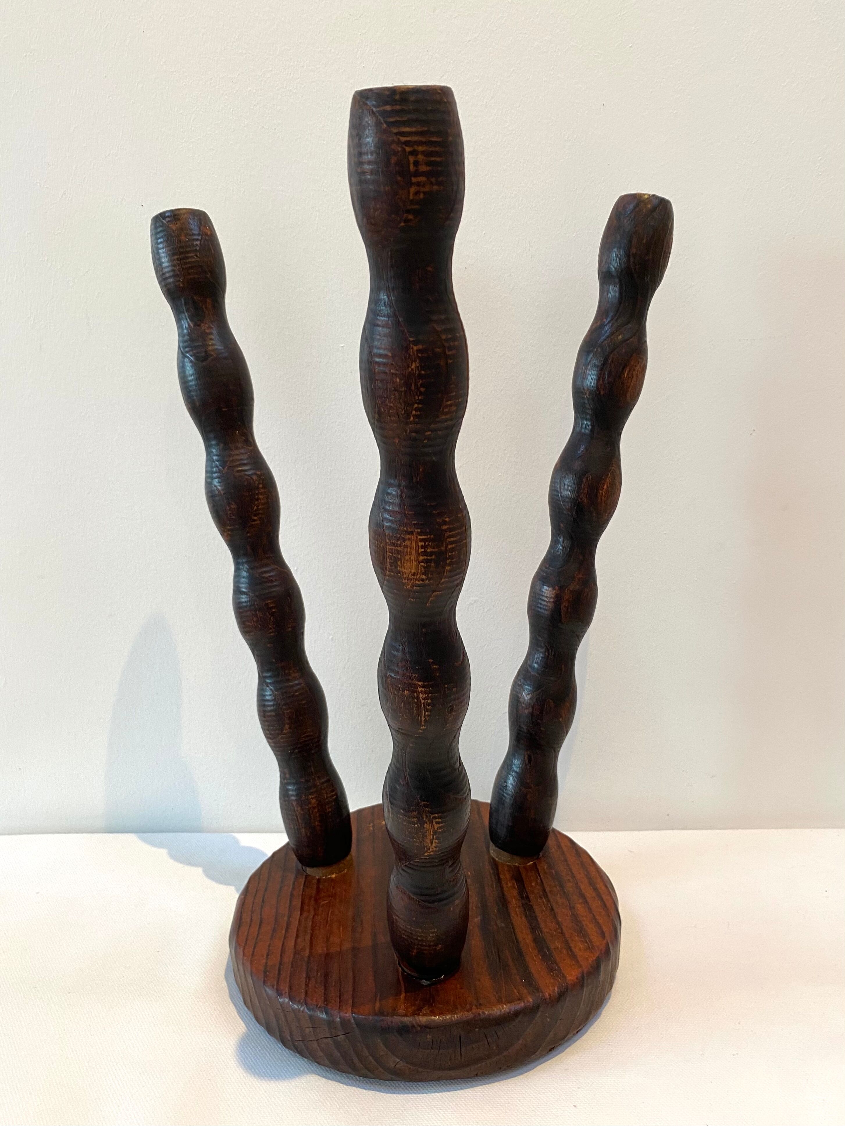 Old tripod stool in solid wood