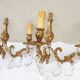 pair of bronze wall lights with pendants