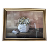 Painting of a flower bouquet in a gilded wooden frame.