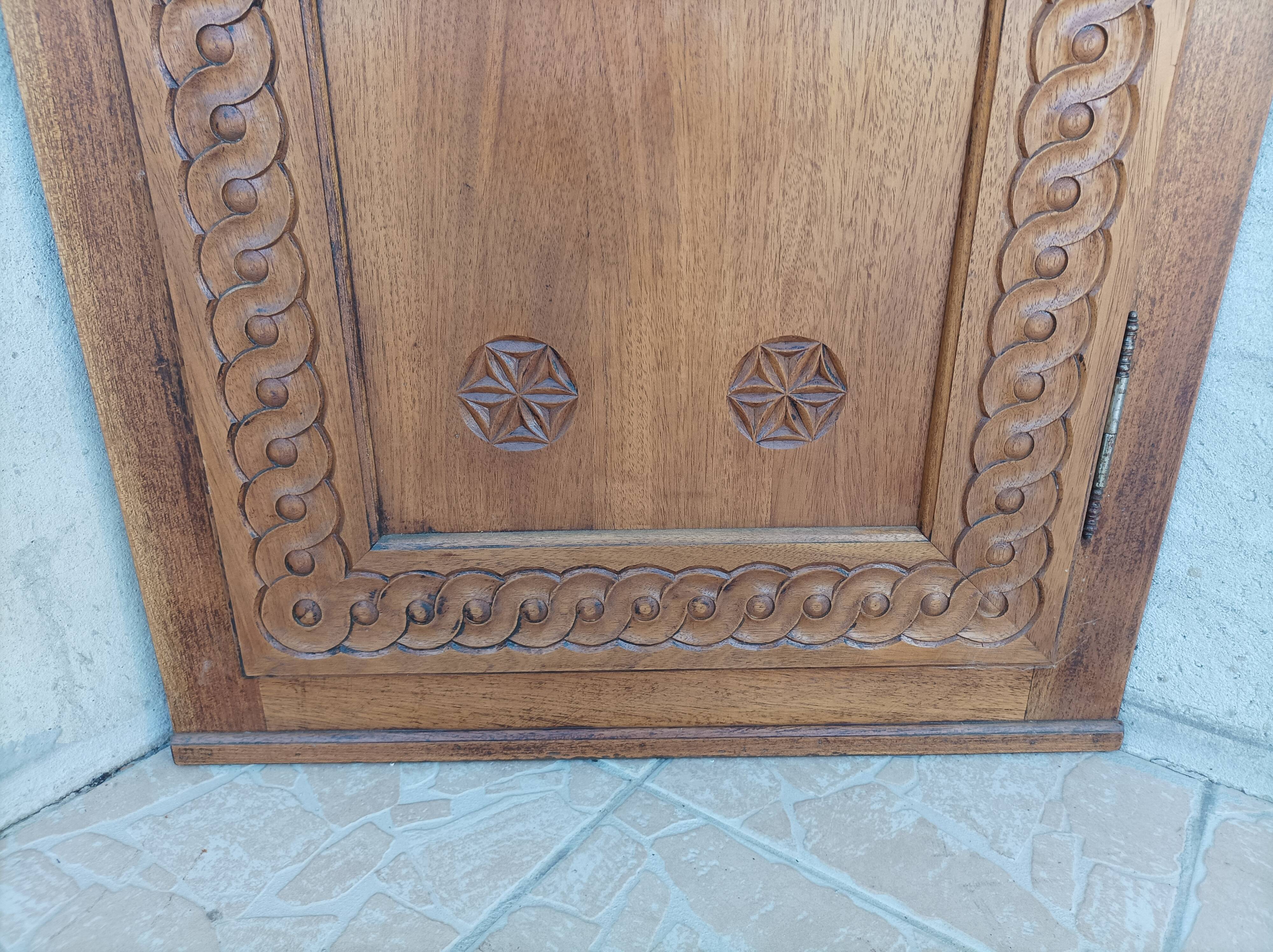 Corner cabinet in carved walnut, Savoyard style.