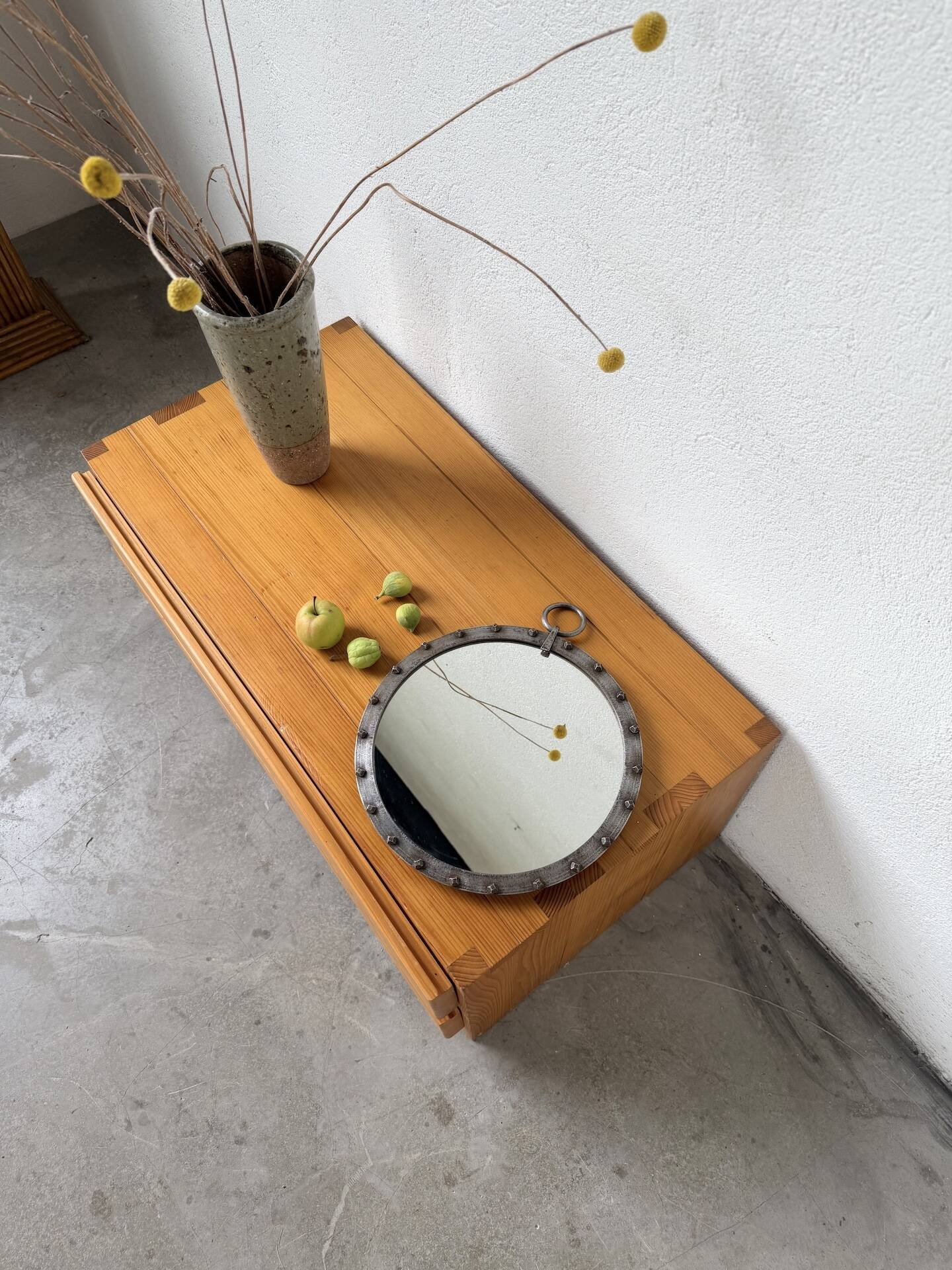 Brutalist round mirror with wrought iron and studs.