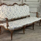Louis XV bench in carved wood with oak patina, 18th century