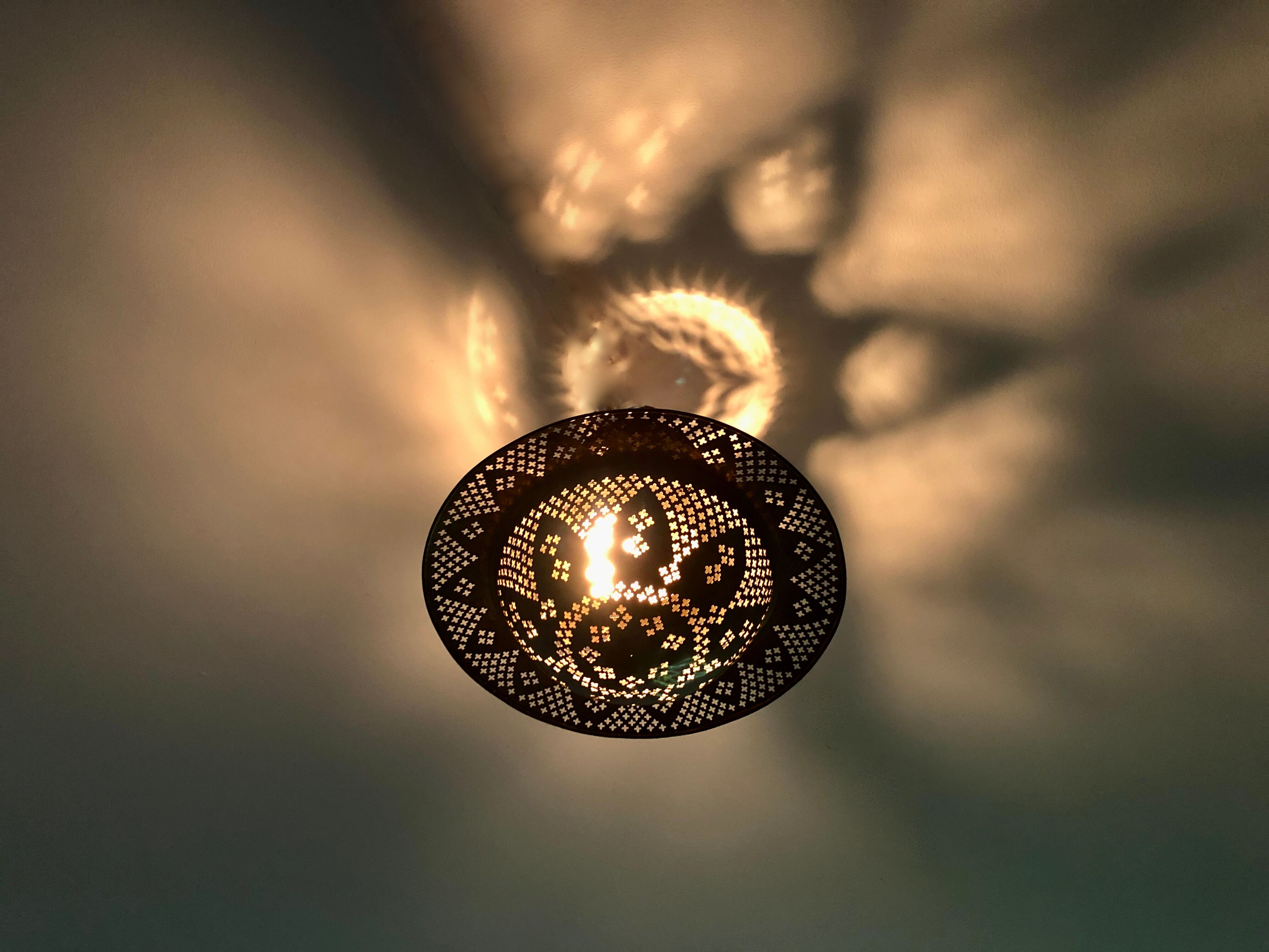 Perforated gilded metal lantern