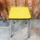 Set of 2 yellow Formica stools