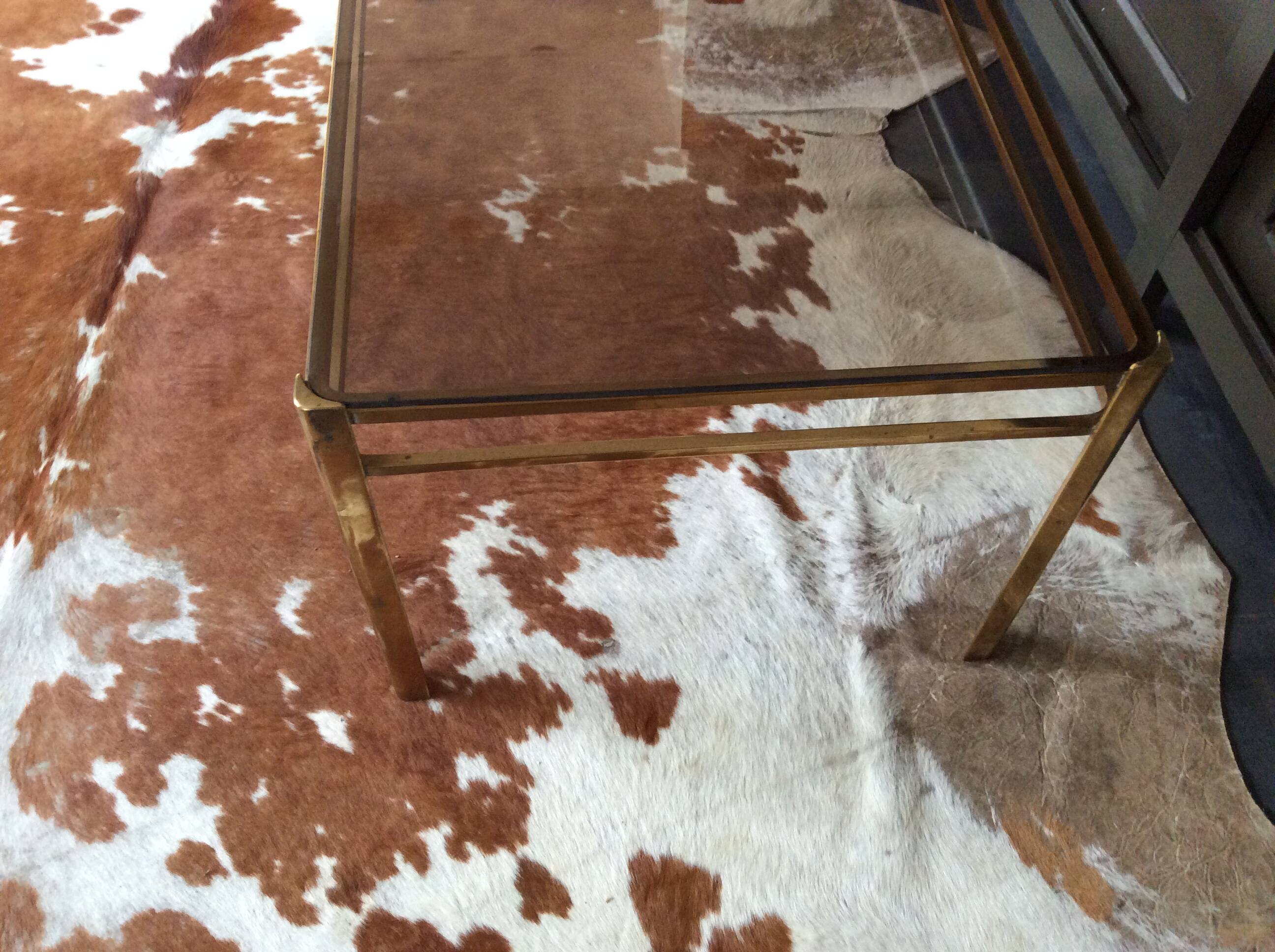 Glass and brass coffee table