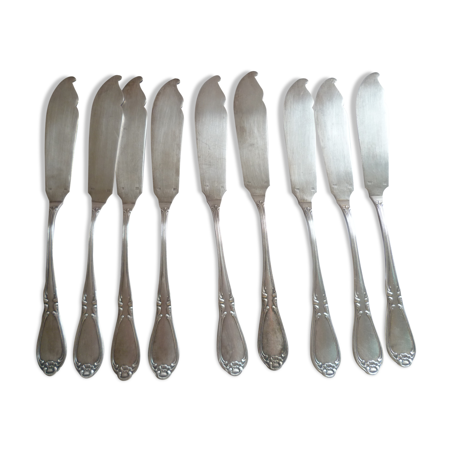 Ens. from 9 fish knives met. argente 1st title "au bon marche" mod.coquille