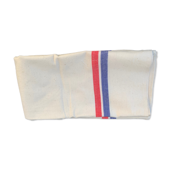Blue and red striped tea towel on vintage beige background