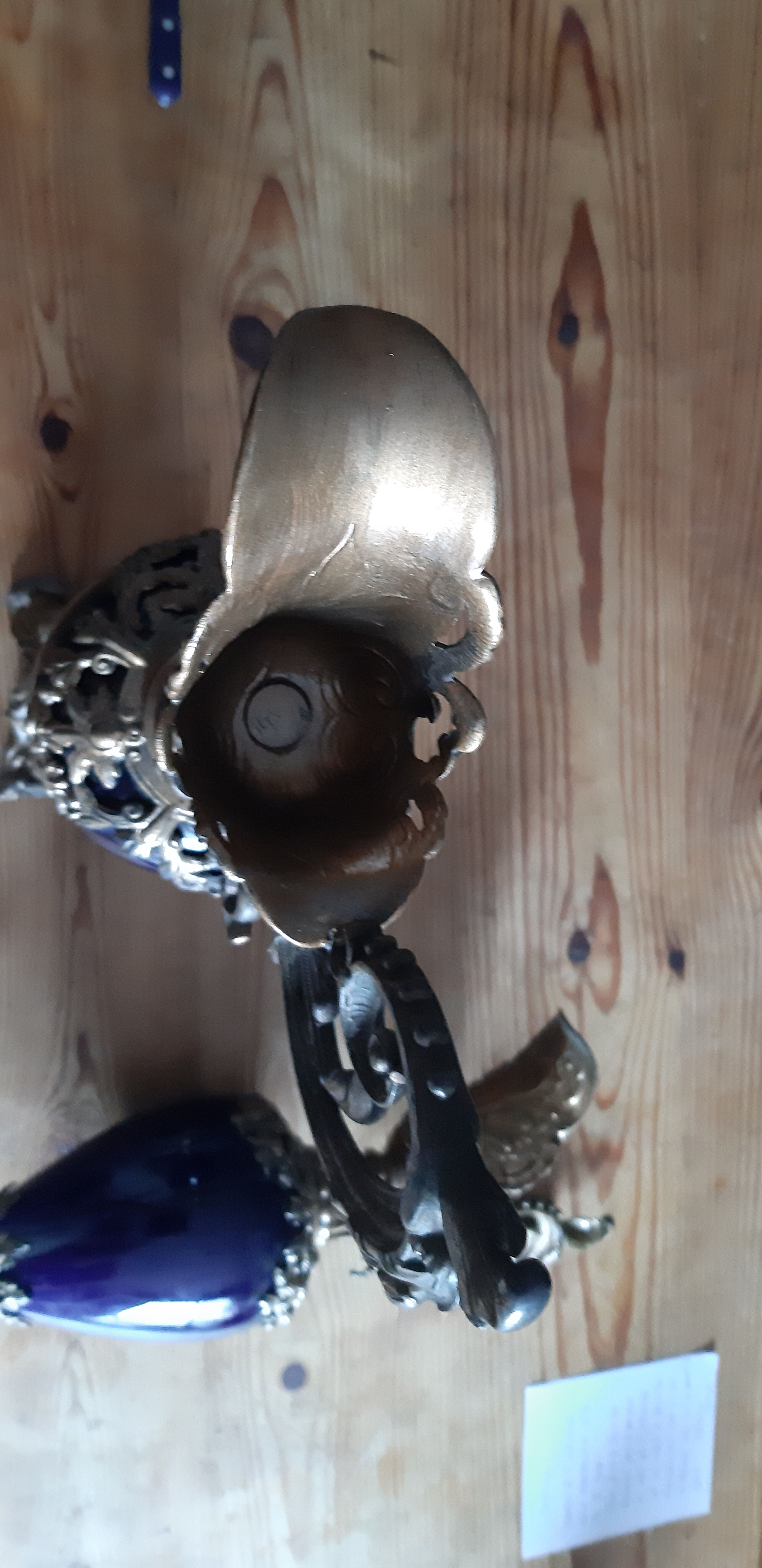 Pair of golden regulated ewers and blue glass