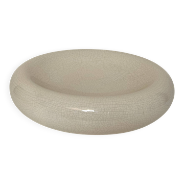 Empty pocket, cracked ceramic dish 1980