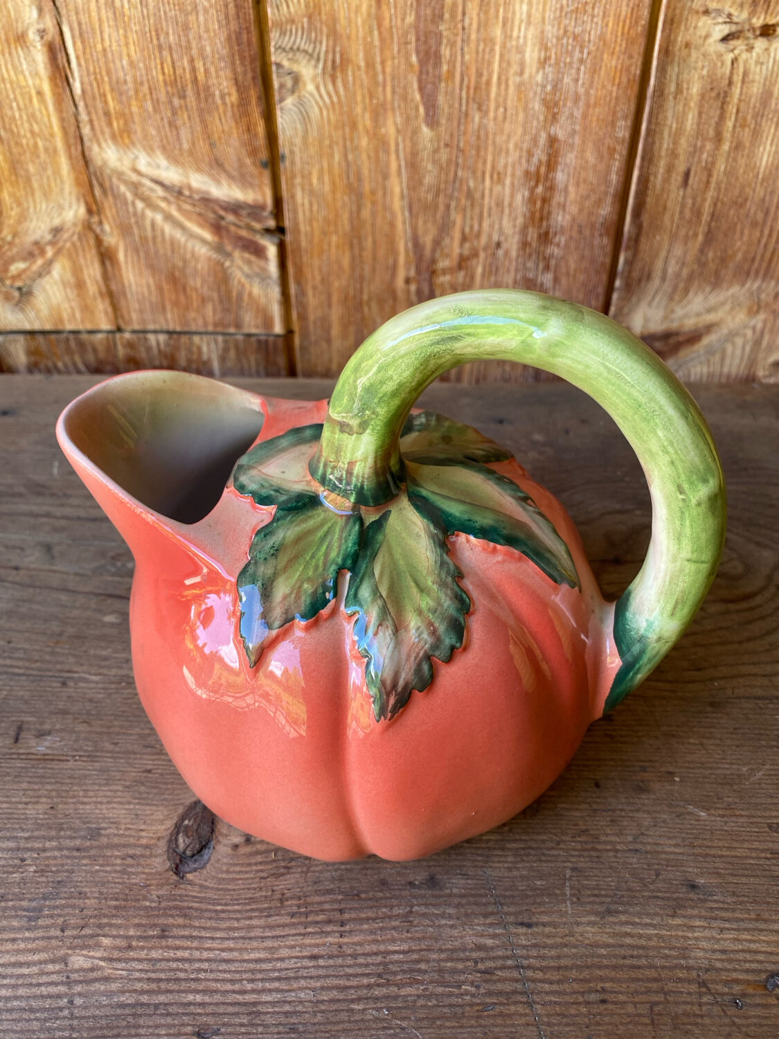Jug in tomato slipware