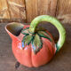 Jug in tomato slipware
