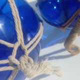 Two blue trawler balls