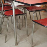 TABLE with two Italian EXTENSIONS and its 6 vintage CHAIRS of the 1970s in red color