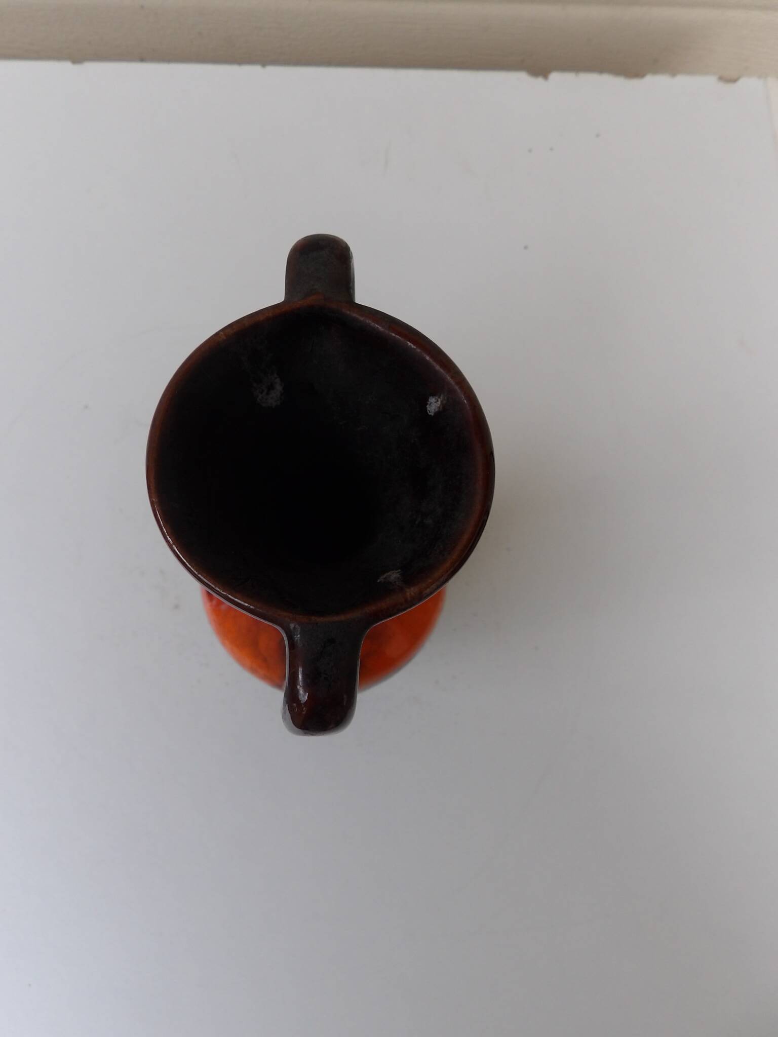 Vase with two orange handles