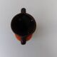 Vase with two orange handles