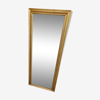 Mirror between two gilded wood frames