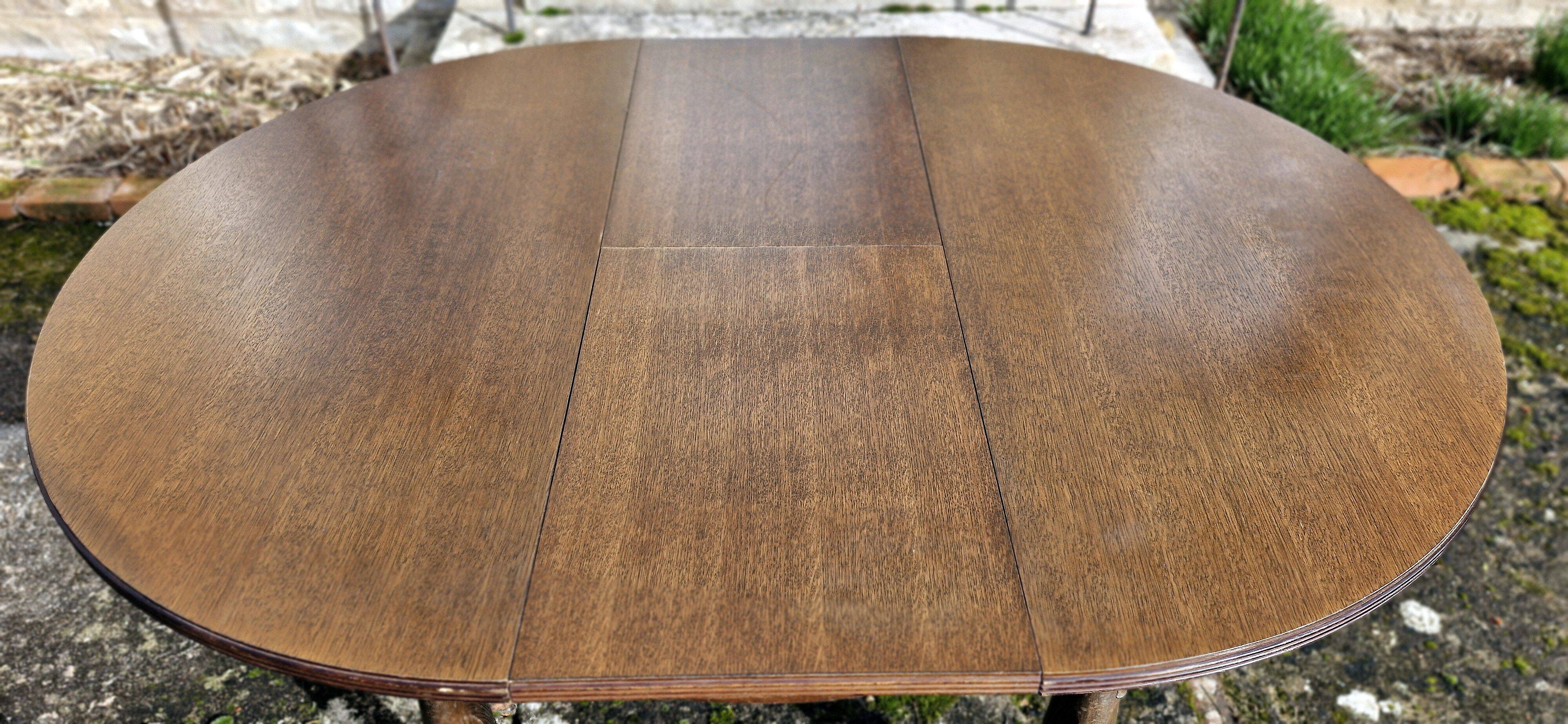 Round wooden table with 1 integrated extension + 6 wooden and fabric chairs