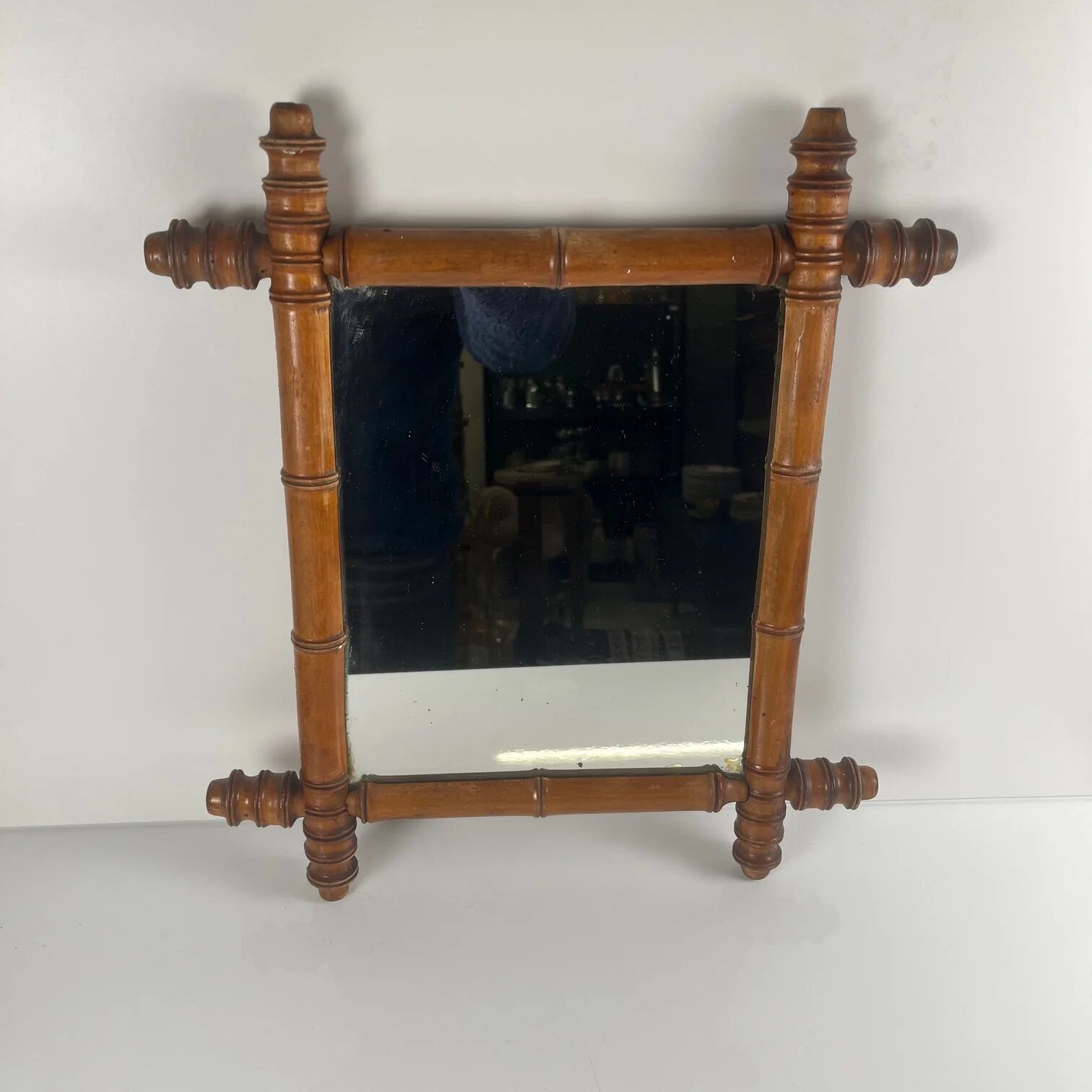 Wooden turned mirror in bamboo style, circa 1900-1930.