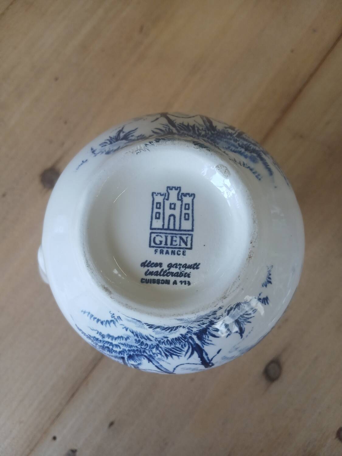 Small old pitcher in iron earth