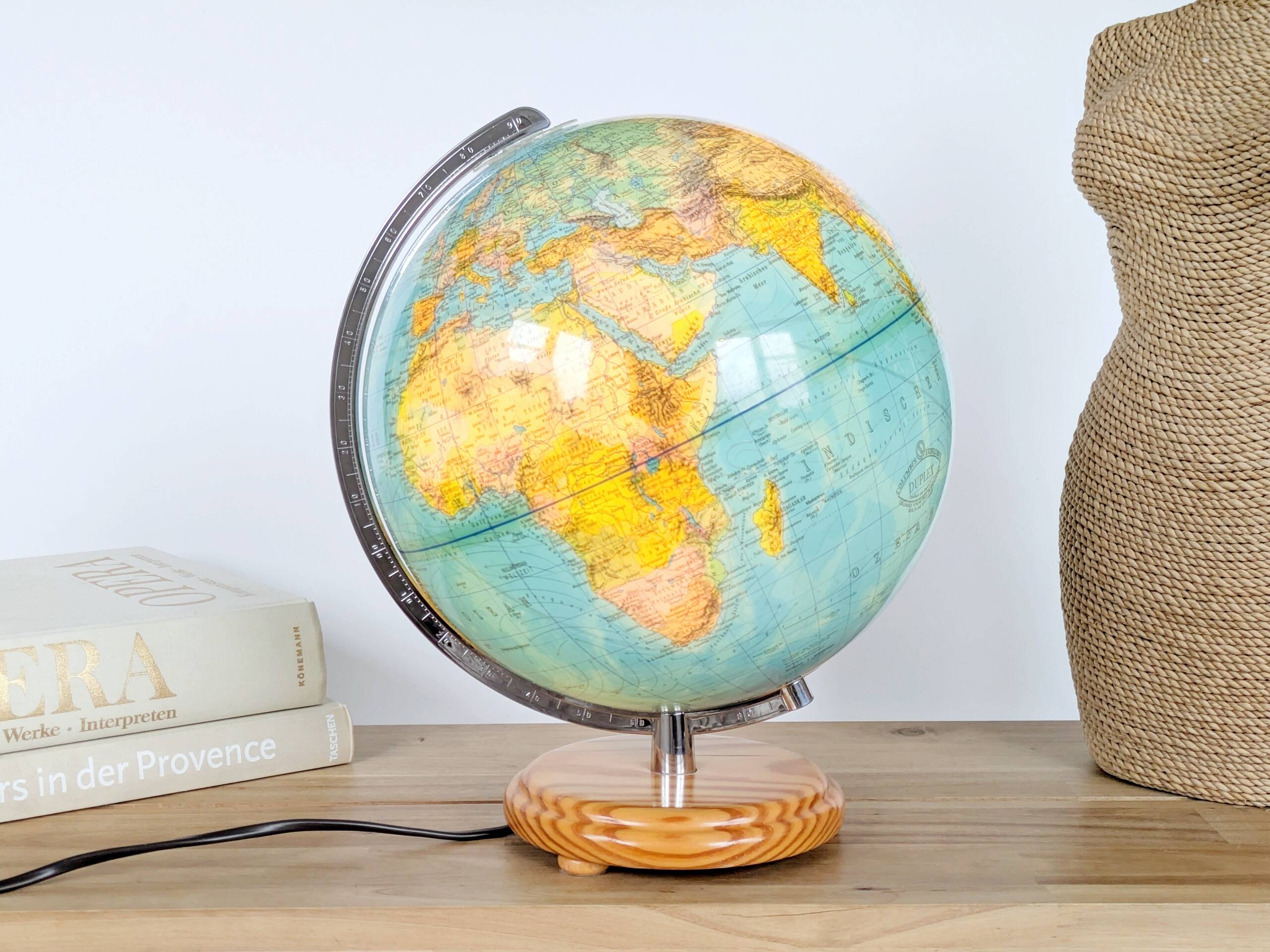 Columbus Duplex illuminated globe on a wooden base, 1980s