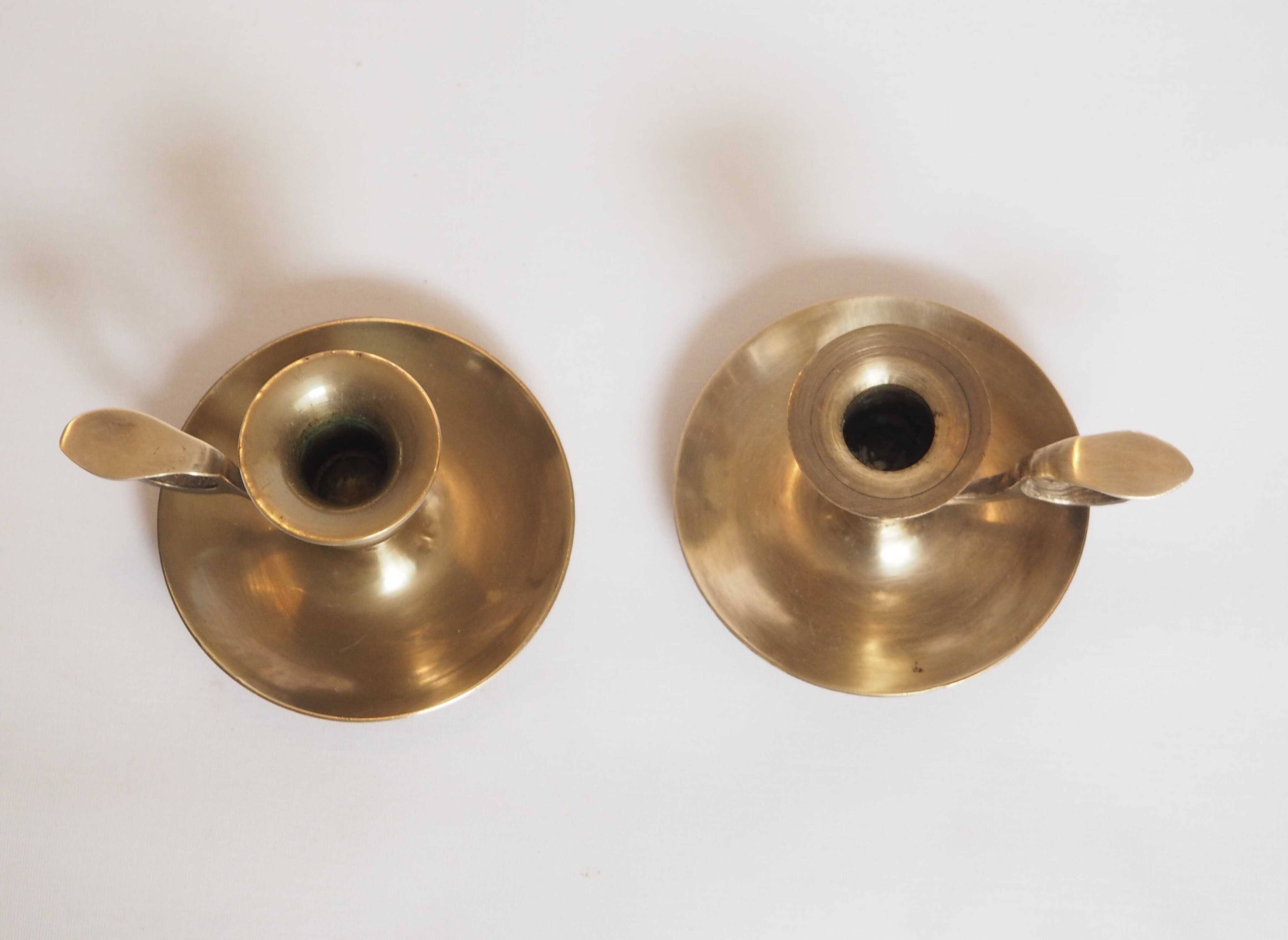 Brass candle holder with cup and handle