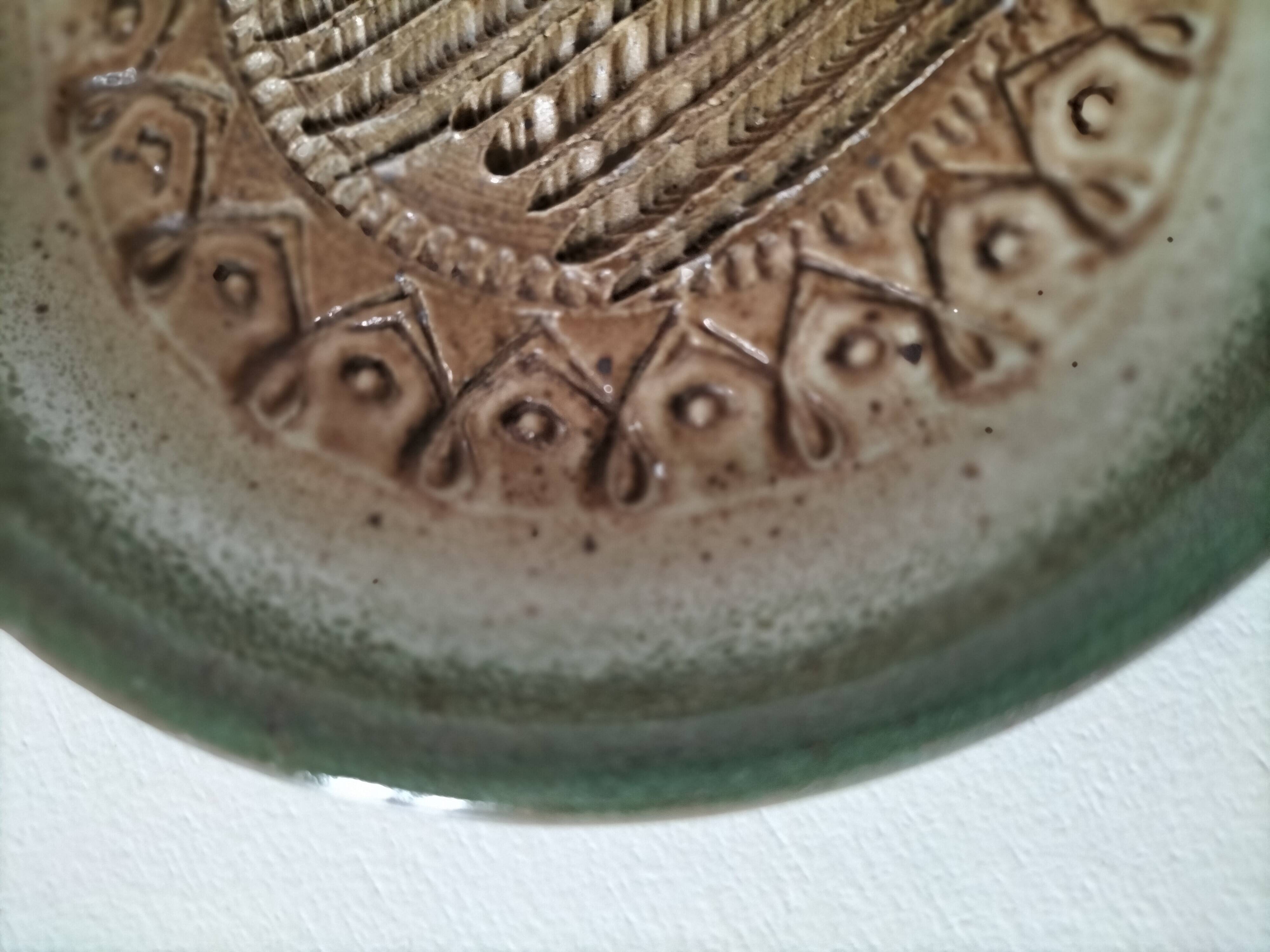 Signed stoneware bowl from Puisaye, relief decoration.