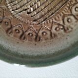 Signed stoneware bowl from Puisaye, relief decoration.