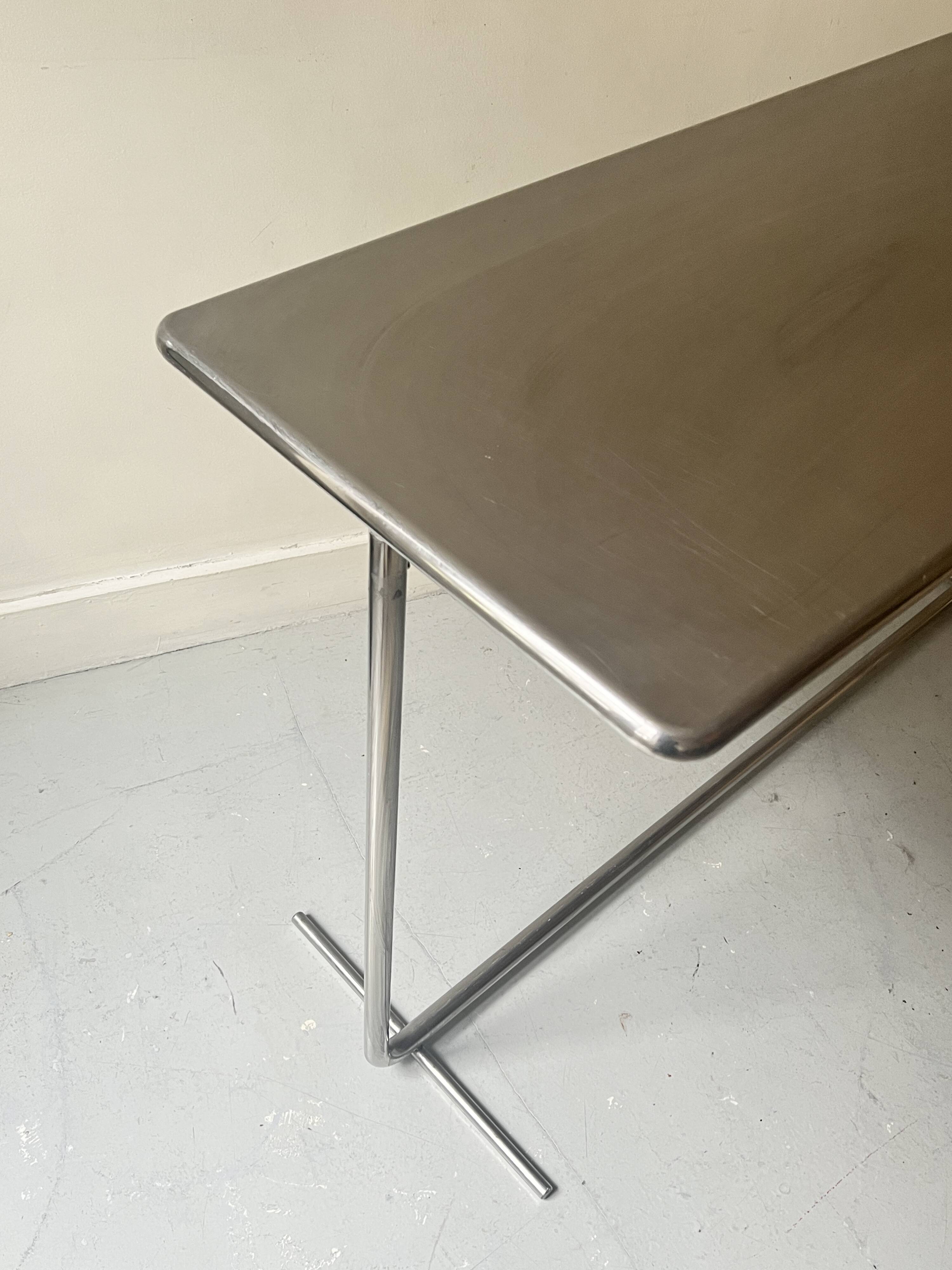 Dining table / tubular and modernist desk in chrome metal