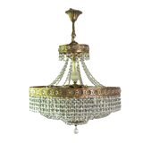 Antique castle style chandelier with tassels and floral details
