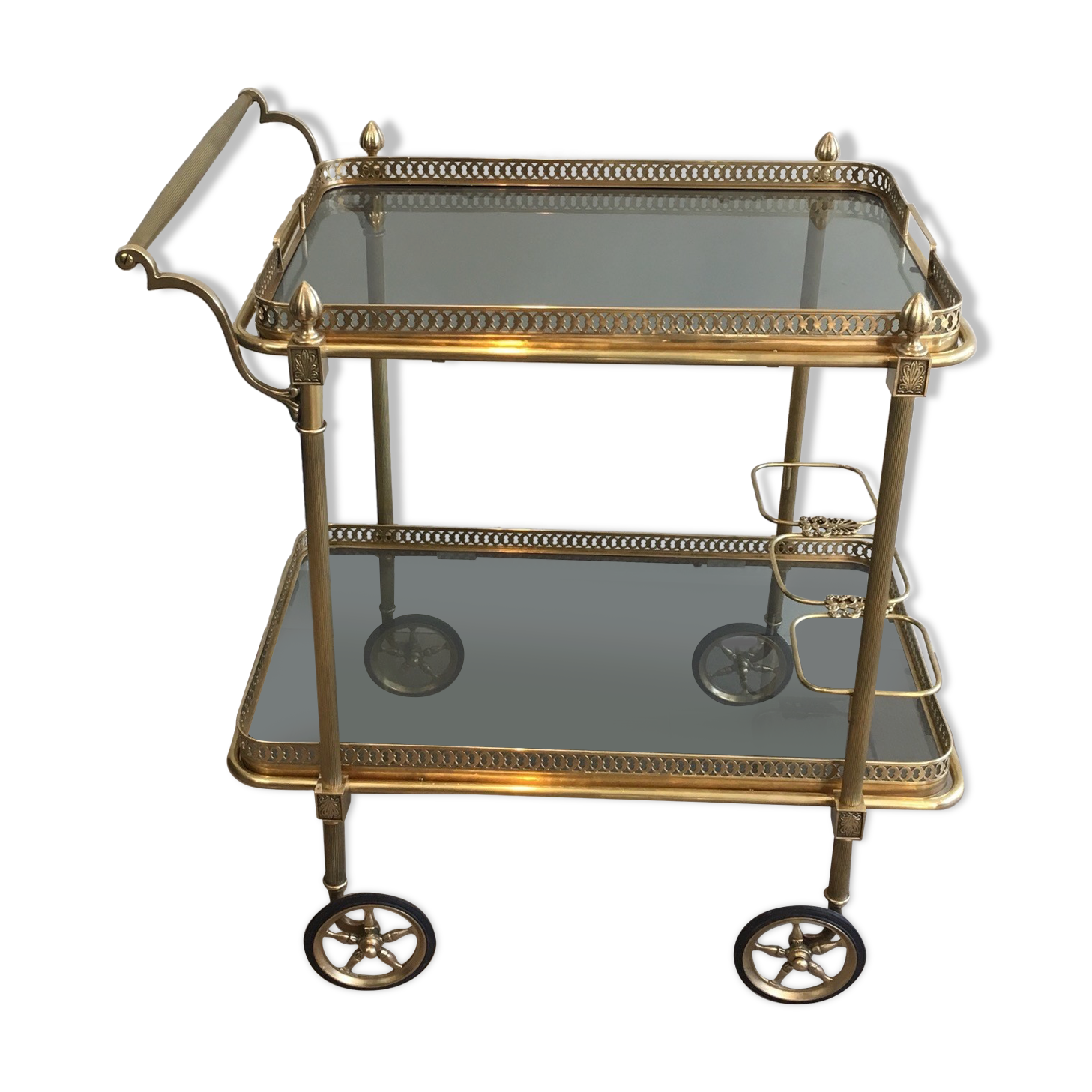 Neoclassical style rolling table in brass with blue glass tops