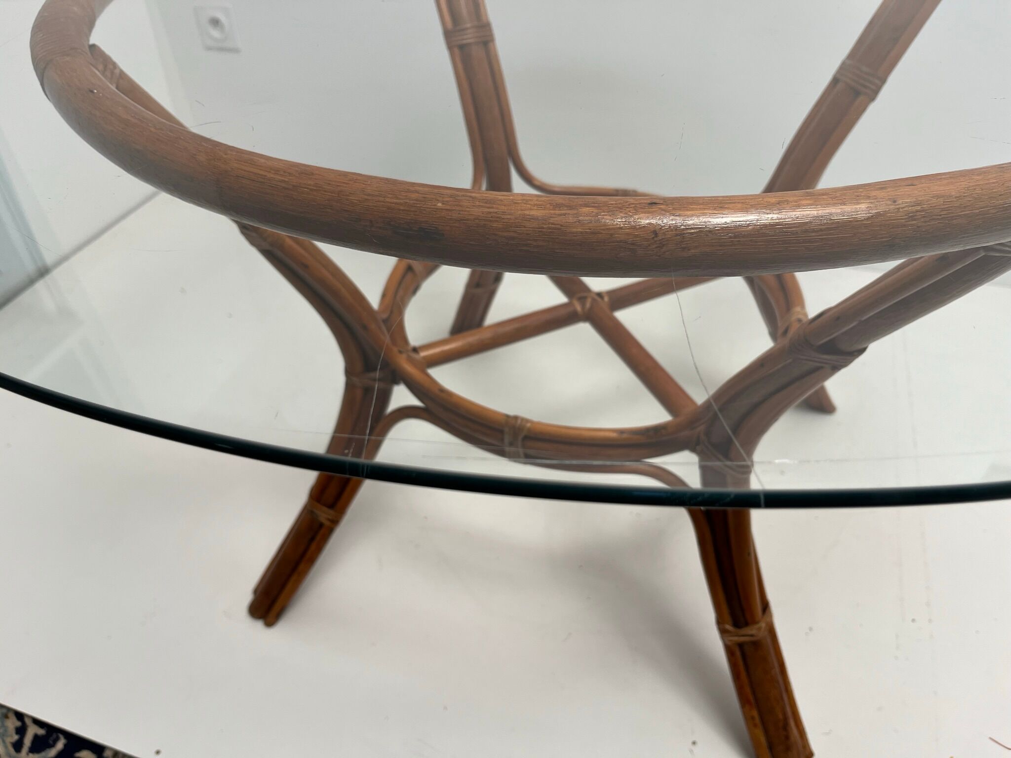 Vintage glass top rattan dining table