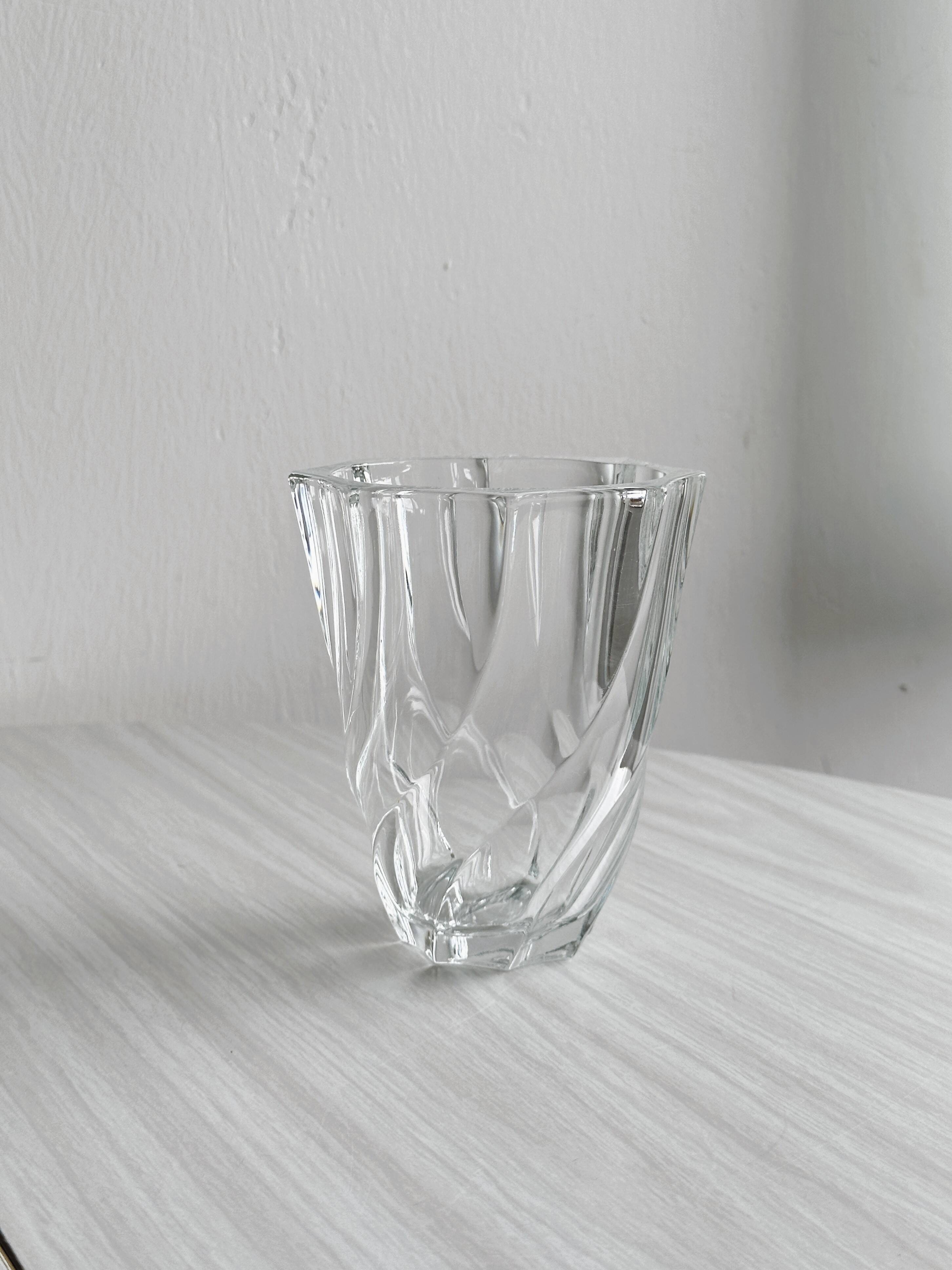 Clear glass vase, twisted design.