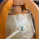 Vintage wooden wall lamp with rope detail.