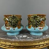 Paire de cache-pots en barbotine à décor de mascarons, XIXe siècle