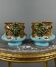 Pair of earthenware cachepots with a mask decoration, 19th century.