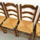 Set of 8 chairs in solid elm with straw seats.
