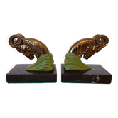Art Deco pair of bookends with ram heads, patinated metal and black marble.