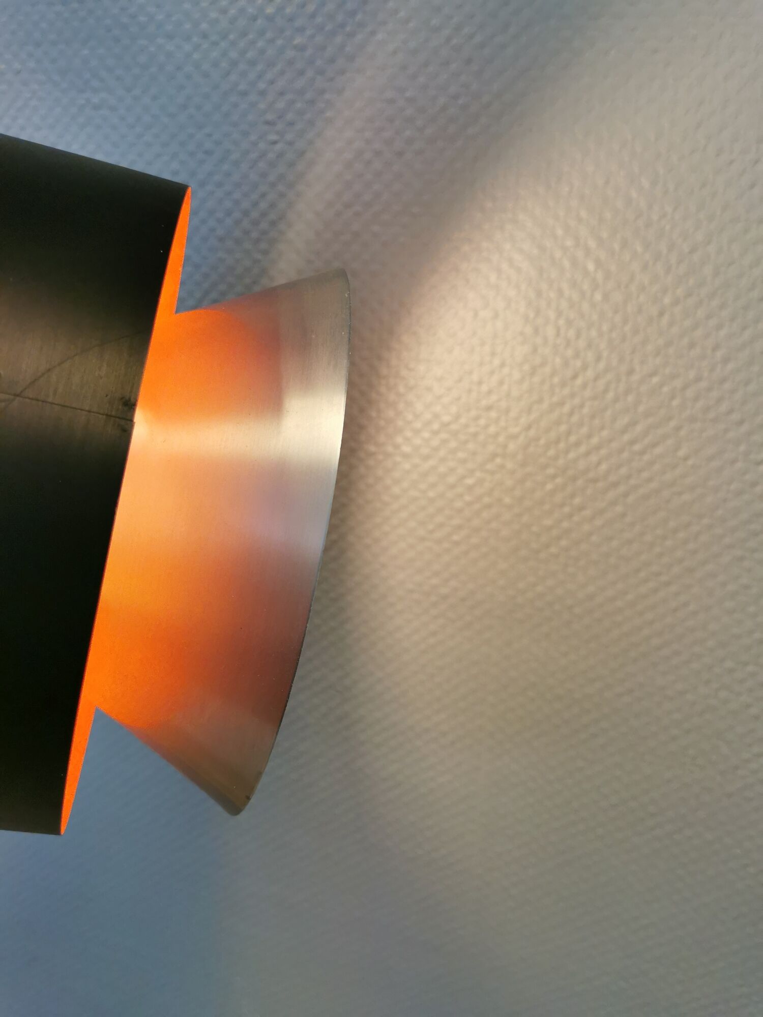 Hanging lamp,  of silver coloured aluminium with black "ring" and orange inner contrast lacquer.