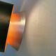 Hanging lamp,  of silver coloured aluminium with black "ring" and orange inner contrast lacquer.