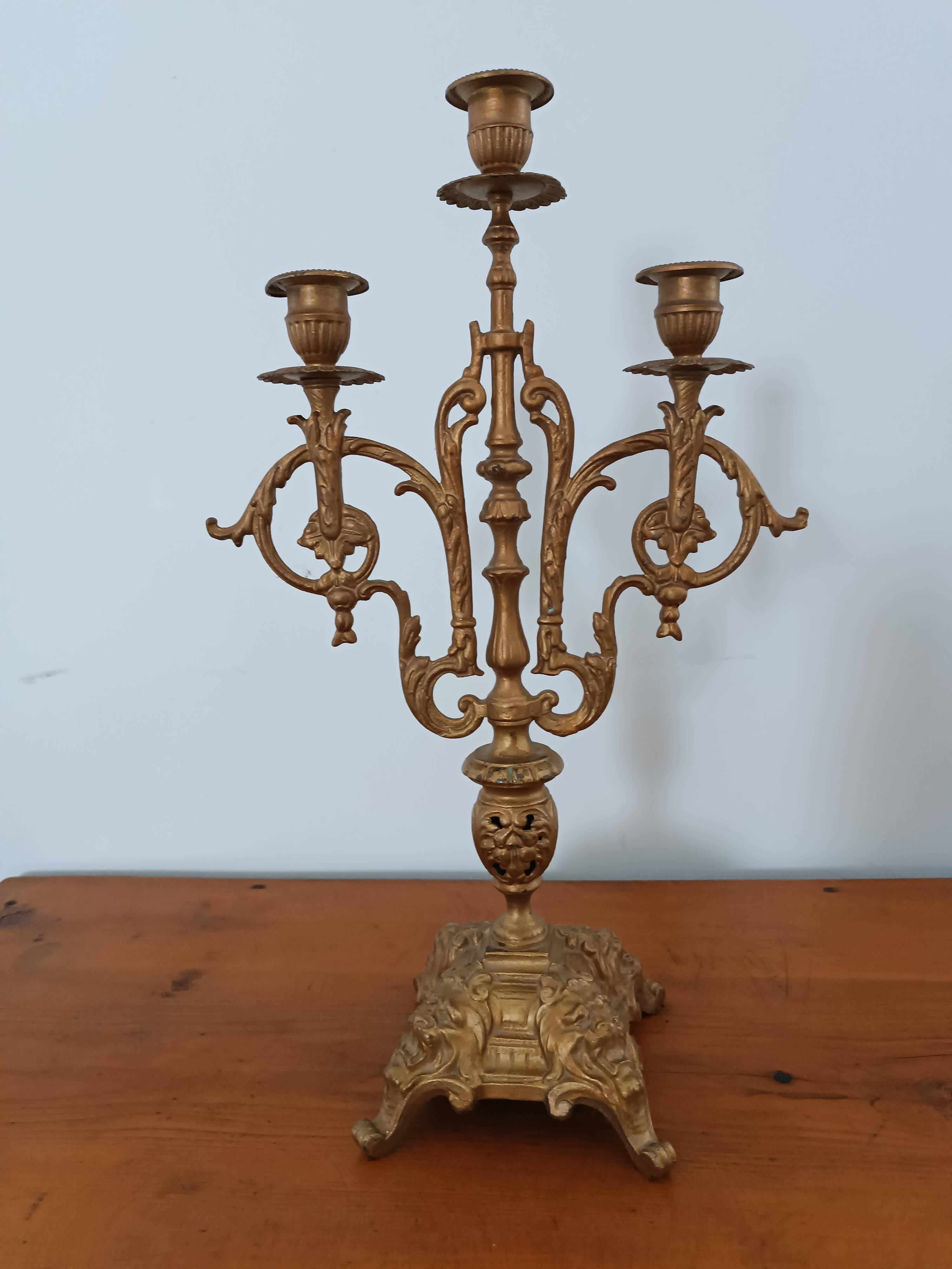 Bronze candlestick with lion head decoration